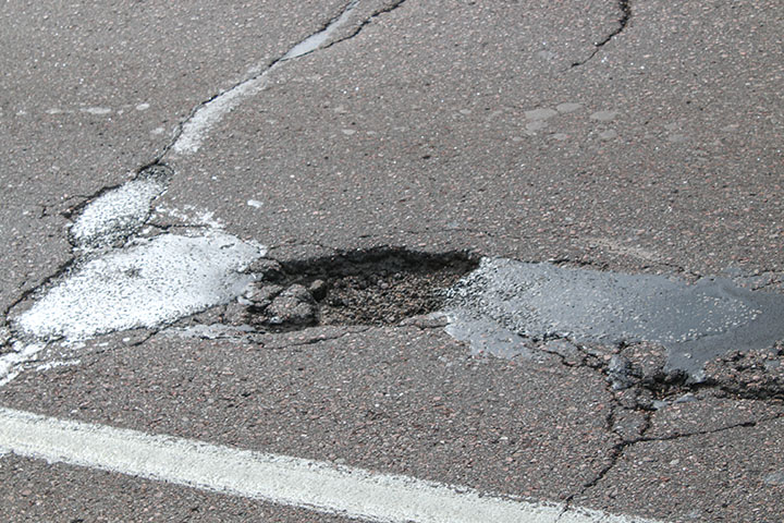 Roadway cracks and potholes detail image