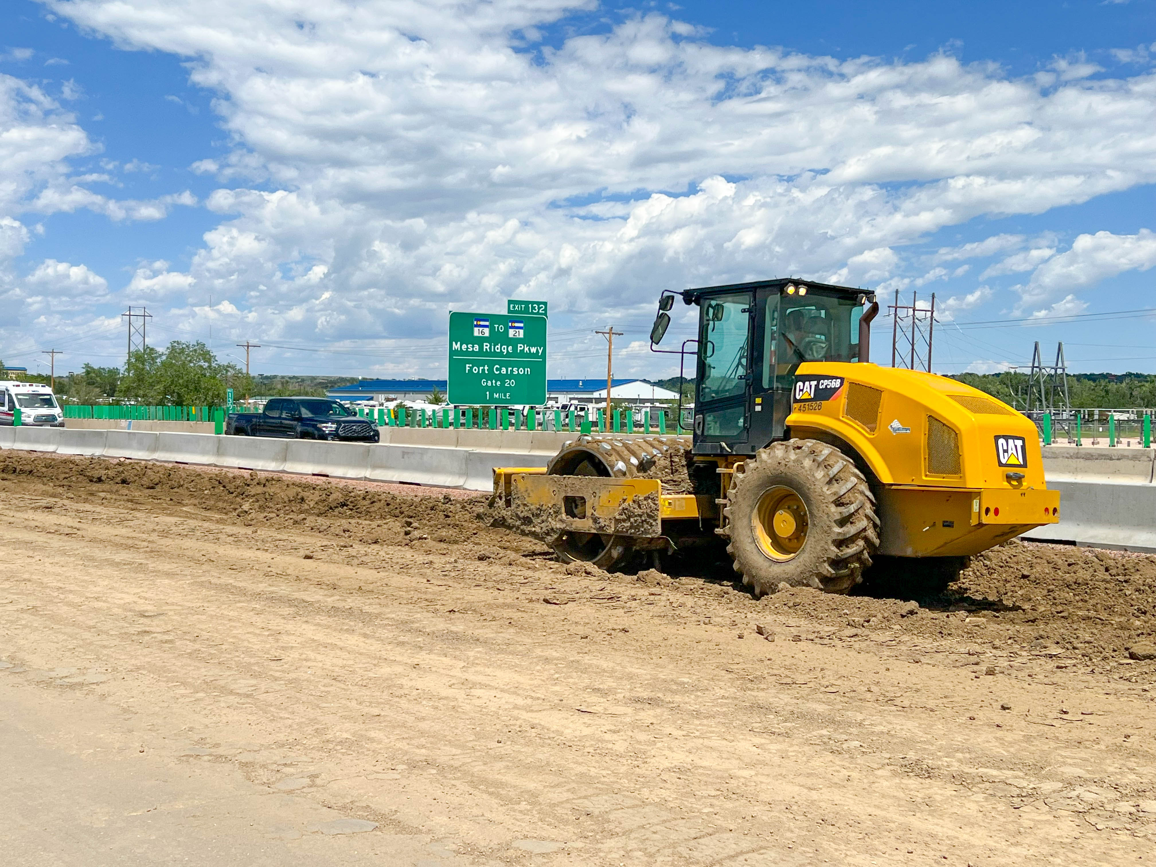 Construction equipment performing roadway compaction detail image