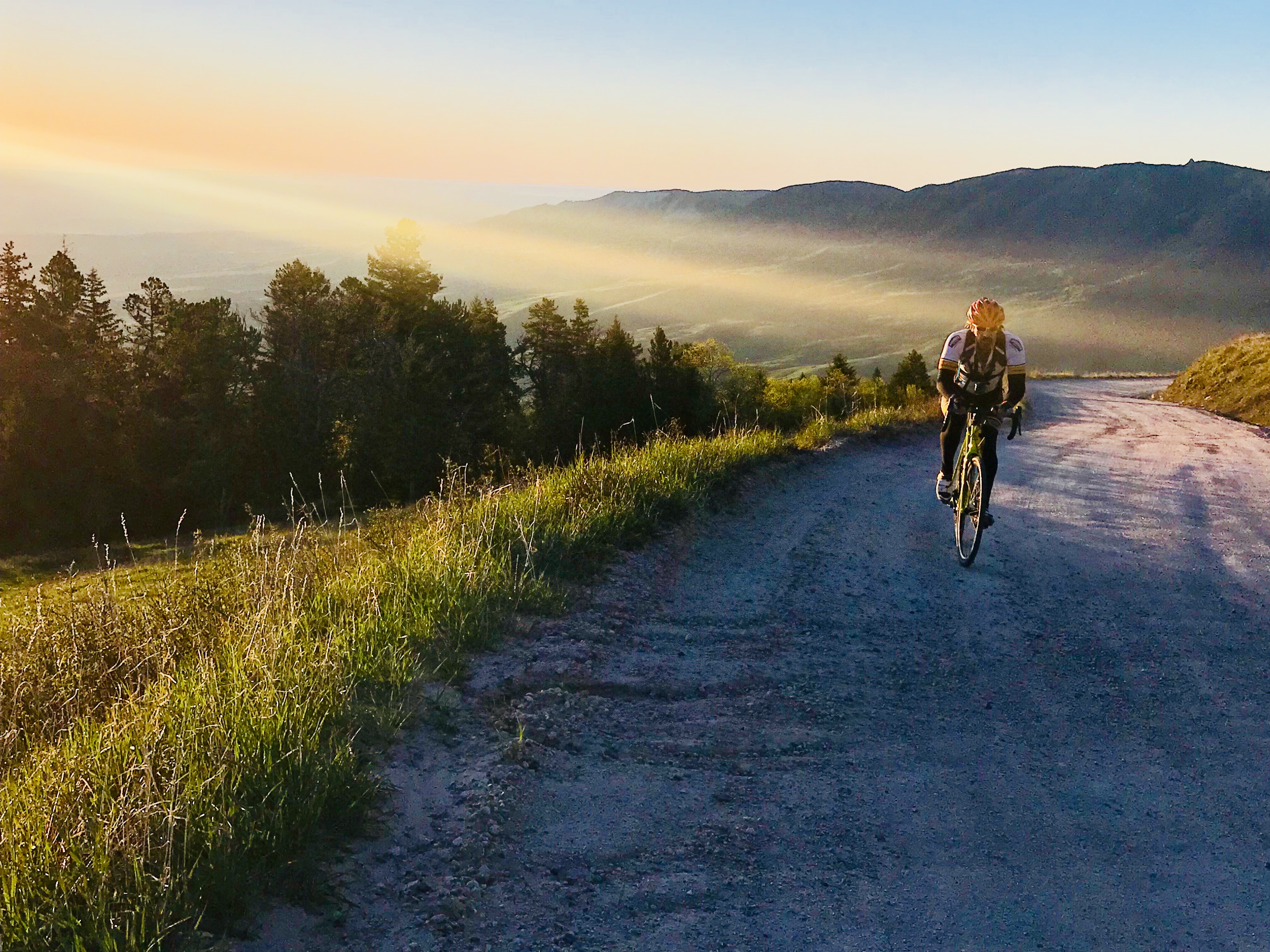 Bicyclist on Dirt Road detail image