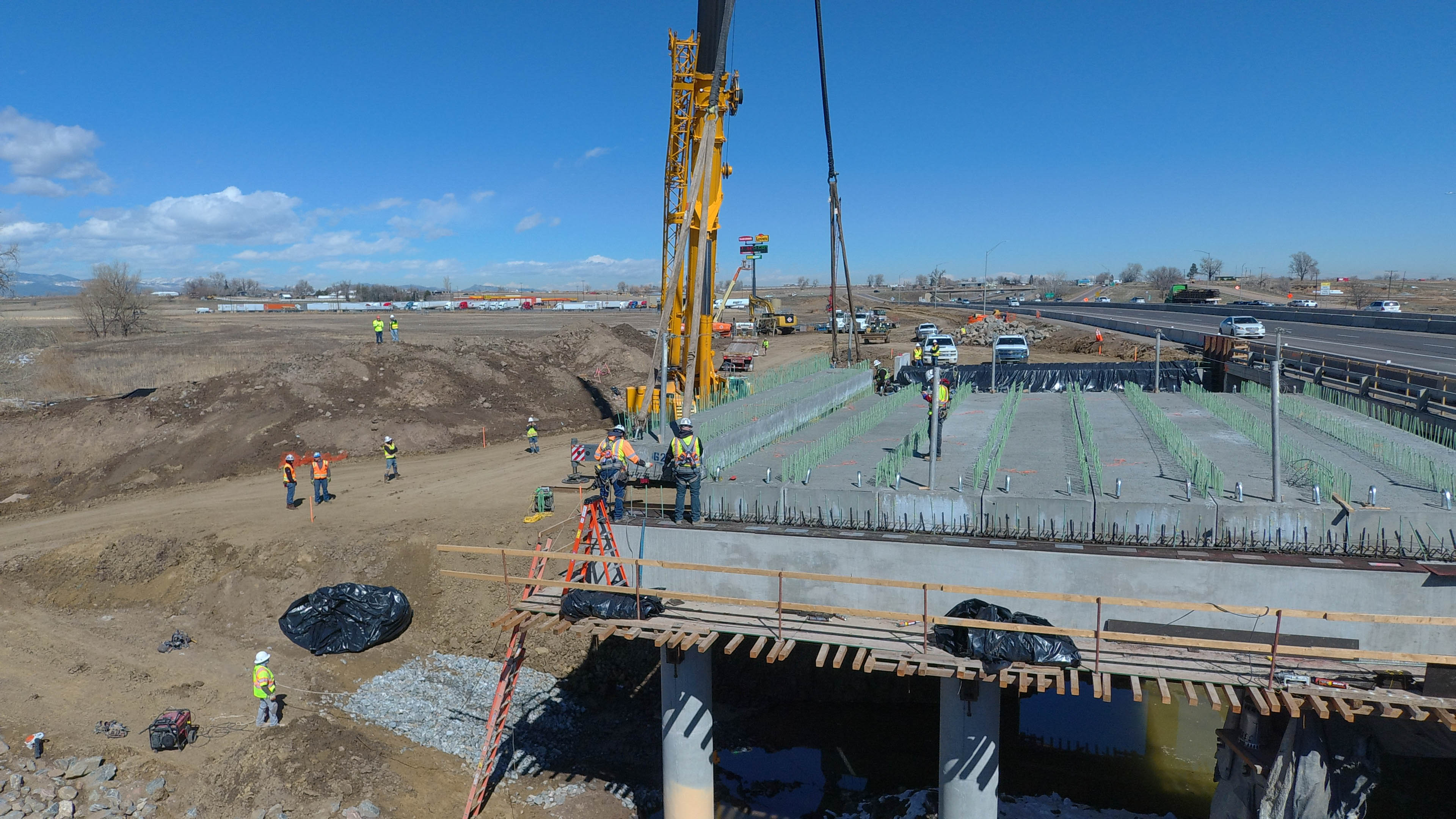 I-25 Segment 6 - Construction Crew Working on Bridge detail image