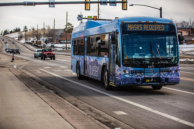 Image of bus driving on a roadway