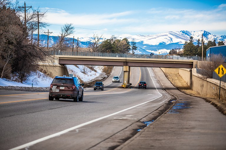cars driving on Arapahoe Avenue in Boulder, Colorado.