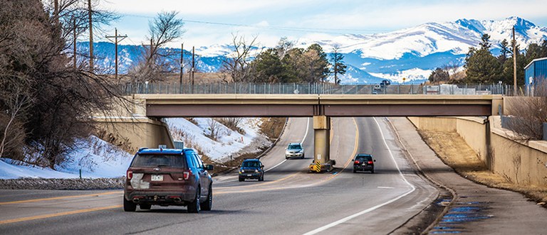 Colorado State Highway 7 (CO 7) in Boulder County, Colorado. Image of cars driving under railroad bridge on Colorado State Highway 7 (CO 7) in Boulder County, Colorado.