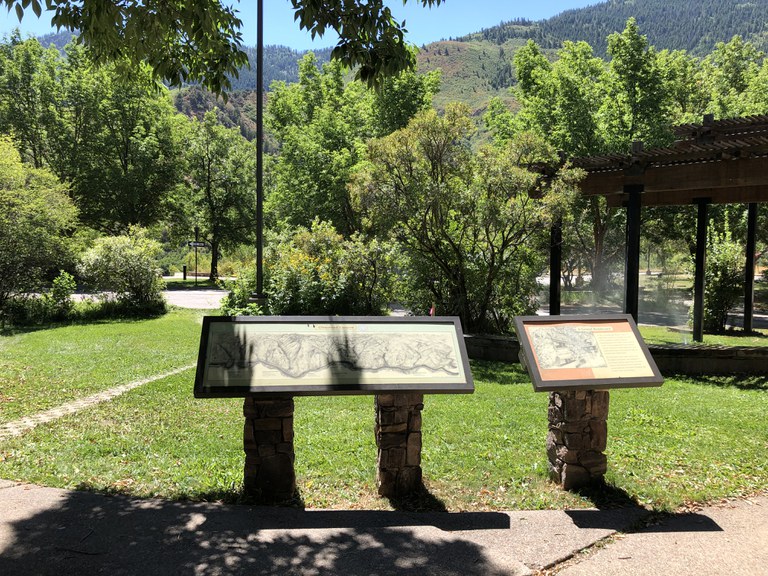 A map and information about the location with mountain backdrop at the No Name rest area