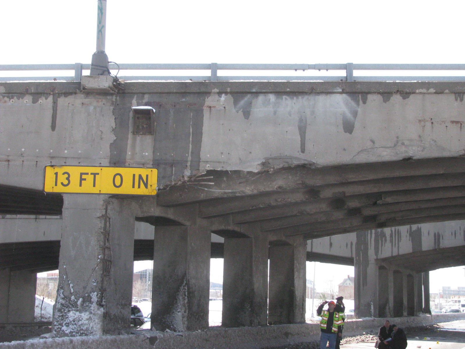 23rd Avenue Bridge with 13 ft 0 in sign and crew members underneath.JPG detail image