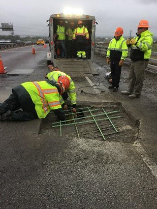 CDOT workers repairing hole in bridge