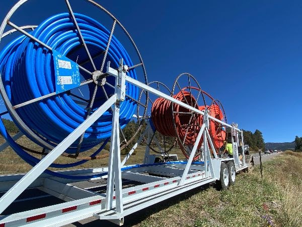 Spools of fiber optic cable conduit were staged and prepped for installation along US 160 north of Pagosa Springs.