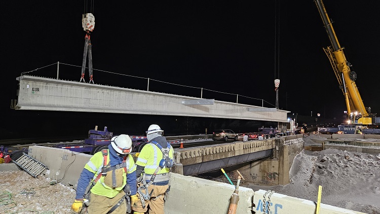 Crane lifting and setting girders overnight for new US 285 bridge BasisPartners.jpg detail image