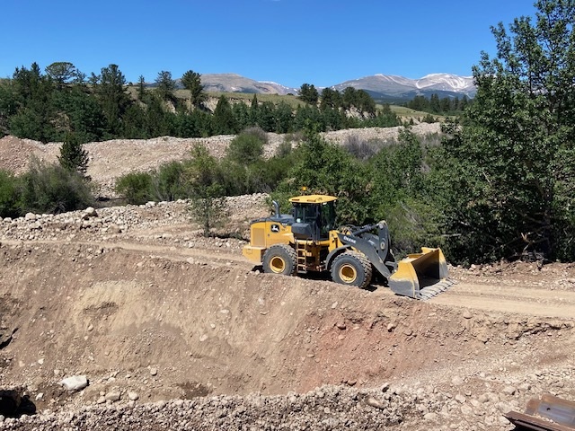 Crews clearing for cantilever wall construction US 285 Fairplay photo Estate Media.jpg detail image