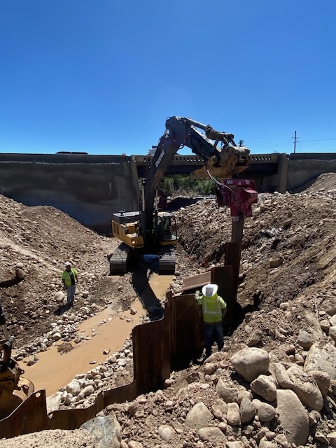 US 285 CO 9 Intersection Improvements and Bridge Replacement Closeup View Crews Diverting Water and Setting Barrier.jpg detail image