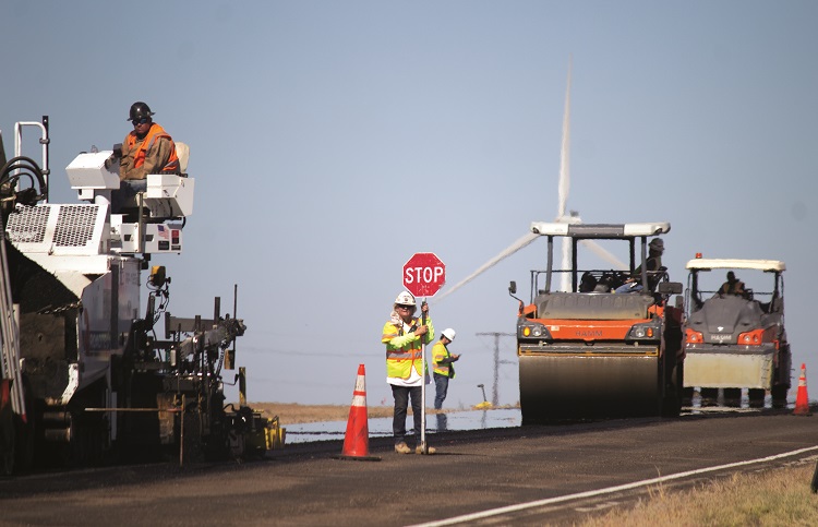 flaggers directing traffic during paving operations US 385.jpg detail image