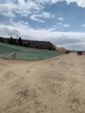 This photo was also taken from the northbound side of US 85, looking south. This photo shows a new driveway for the residents at 6800 US 85 along with crews in the distance excavating the southern bluff. (April 2021 - photo provided by Castle Rock Construction) thumbnail image