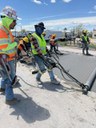 US 85 Concrete Panel Replacement Crews use a roller screed to smooth and level freshly poured concrete on May 2025.jpg thumbnail image