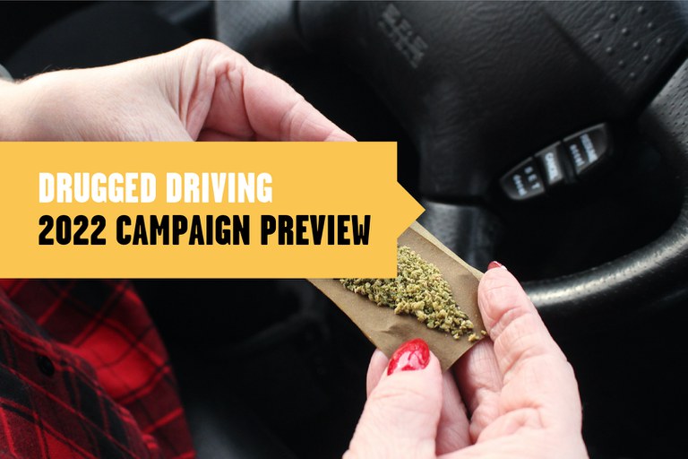 Drugged_Post1v2 Cannabis in a rolled joint behind a steering wheel, text overlay reads "Drugged Driving: 2022 Campaign Preview"