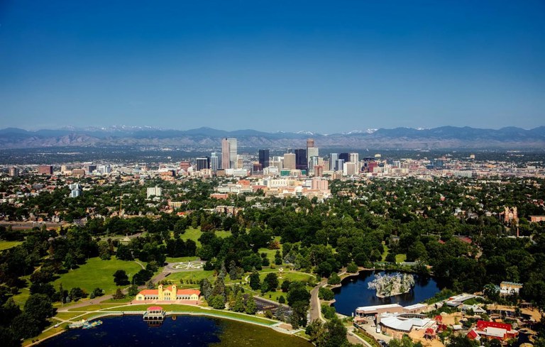 Ariel view of downtown Denver with the mountains in the background.