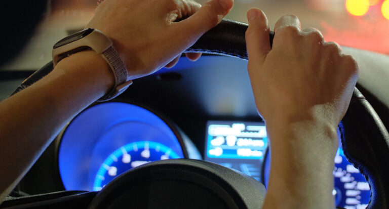 Hands on steering wheel detail image