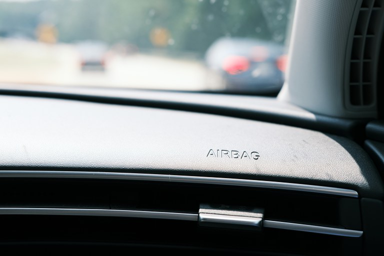IIHS crashworthiness tests save nearly 50,000 lives Airbag label on the interior dashboard of a vehicle.