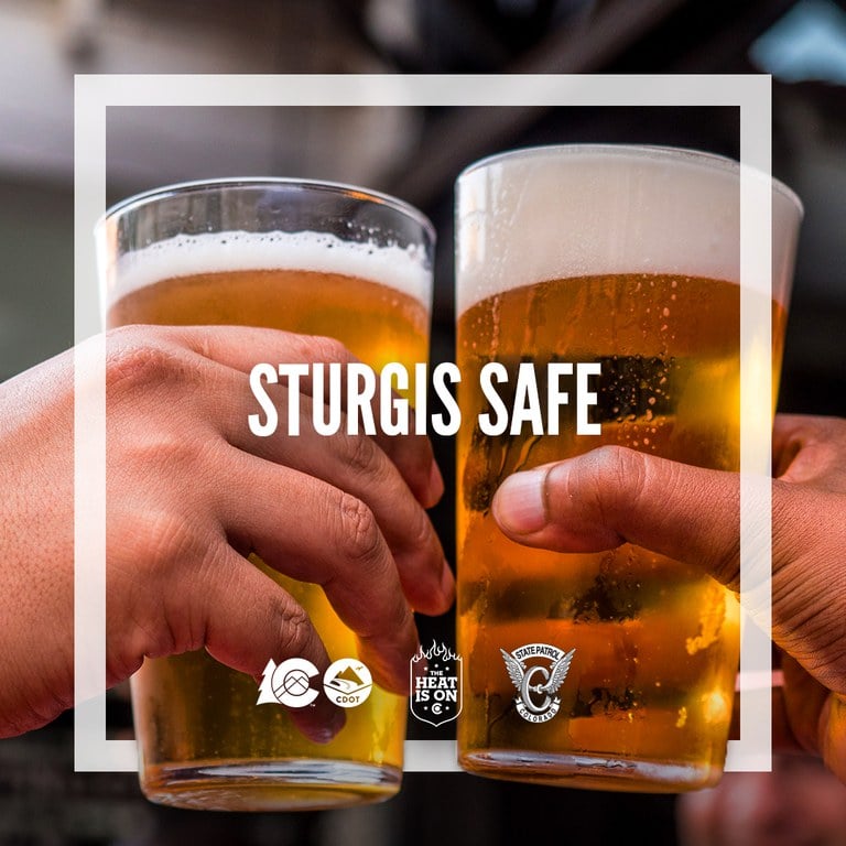 2 individuals cheer-sing beers at a bar, text overlay reads "Sturgis Safe"
