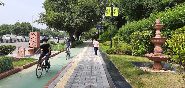 Pedestrians walking and biking on a pathway