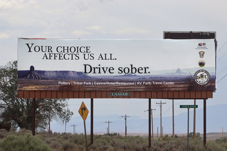 Billboard reads "Your choice affects us all. Drive sober"