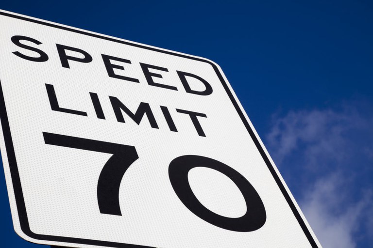 Speed limit sign designating car speed as 70 miles per hour