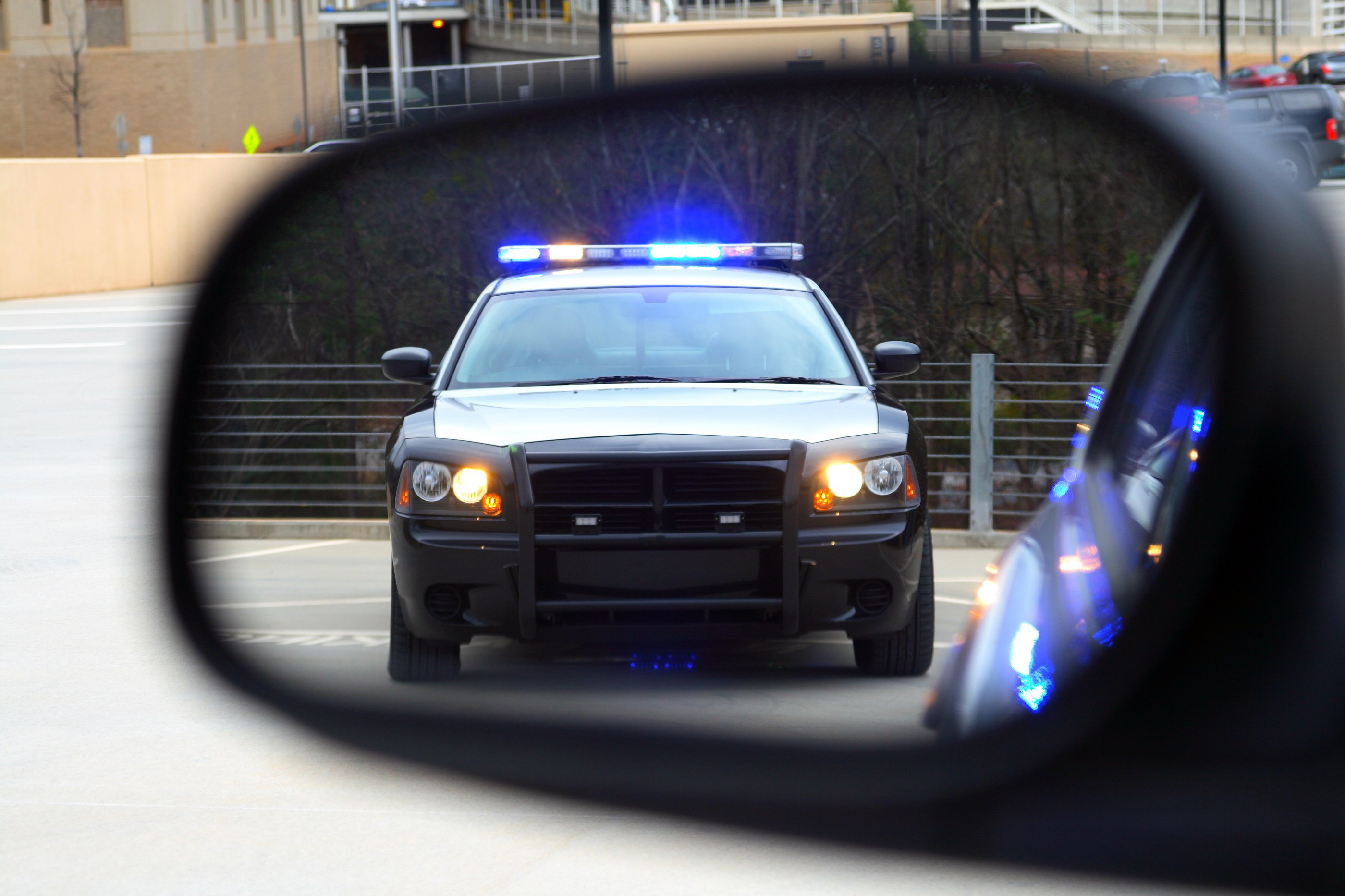 Cop in rearview mirror.jpg detail image