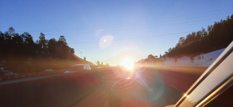 Intense sun glare on eastbound Interstate 70 at Floyd Hill in Colorado 